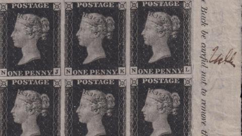 An image of six stamps which the Queen's head on them. Three of them say 'ONE PENNY' and the other three say 'POSTAGE'. There is writing on the the right hand side of part of a sentence which says 'Back be careful not to remove the'. Beside that to the right, there is a brown signature.