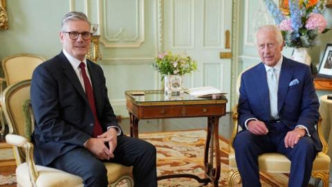 King Charles talks with Sir Keir Starmer during an audience at Buckingham Palace on 5 July 2024