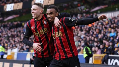 Eli Junior Kroupi and Adrien Truffert celebrate the Bournemouth teenager's stunning strike at Wolves