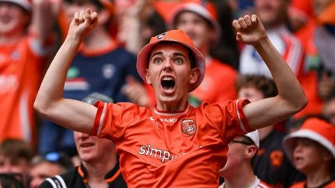 Young Armagh GAA fan cheering