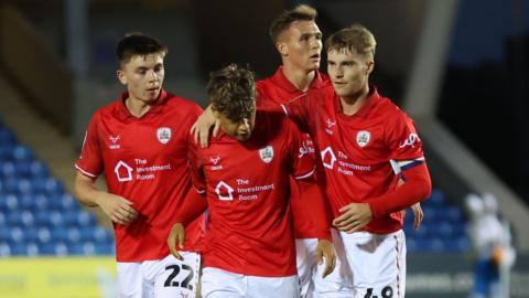 Barnsley players celebrate at Peterborough