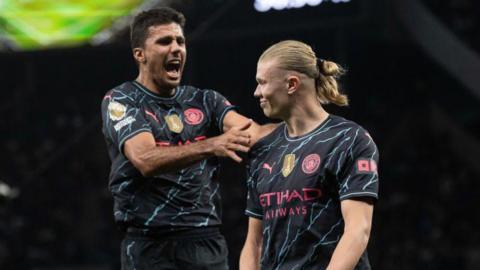 Rodri (left) and Erling Haaland (right) celebrate a goal for Manchester City