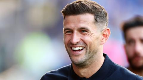 A smiling Portsmouth boss John Mousinho