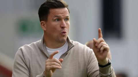 Exeter City boss Gary Caldwell on the sidelines