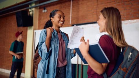 Happy high school students celebrating excellent grade on a test. - stock photo
