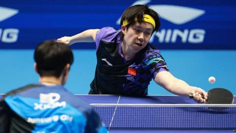 Wang Chuqin playing for China 