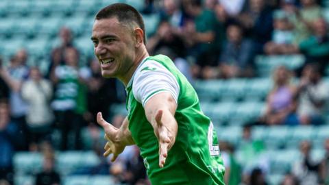 Lewis Miller celebrates after scoring for Hibernian against Peterhead