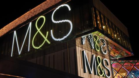 An M&S storefront at night