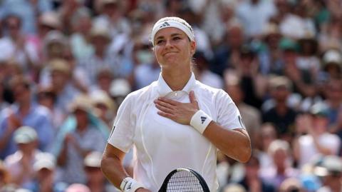 Karolina Muchova acknowledges the crowd at Wimbledon in 2026