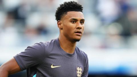 A close up of Ollie Watkins, wearing England's dark blue change kit against Bosnia-Herzegovina on Monday