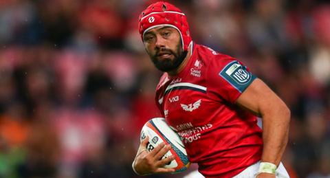 Josh Macleod of Scarlets runs with the ball