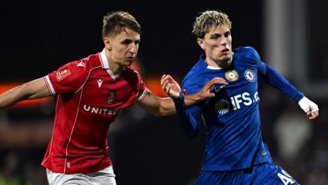 Wrexham's Max Cleworth battles for possession against Alejandro Garnacho of Chelsea