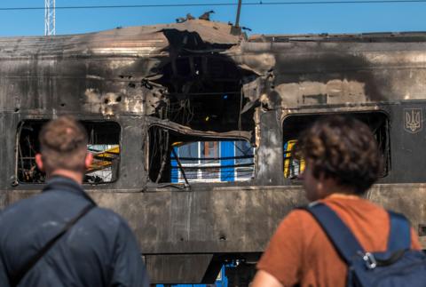 People look at an Intercity+ high-speed passenger train damaged in a morning Russian attack in Kyiv, Ukraine, 28 August 2025, amid the ongoing Russian invasion. Russia struck the Intercity train depot and a railway junction in Kyiv, damaging one train but causing no injuries among depot workers, who were in shelters, according to Ukrzaliznytsia Chairman Oleksandr Pertsovsky. At least 14 people, including three children, were killed and 38 injured in the capital as Russia launched an overnight attack with 598 drones and 31 missiles, according to the State Emergency Service.
