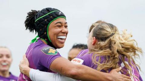 Sadia Kabeya celebrates with a team-mate during a Loughborough Lightning match.