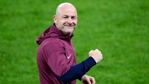 Lee Carsley is wearing a claret-coloured hoodie and pumping his fist to the crowd after an England Under21s win.