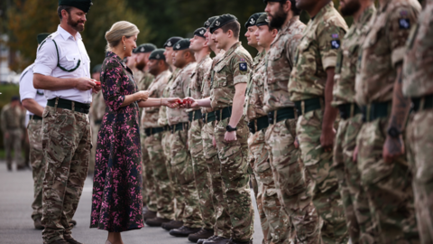 HRH, the Duchess of Edinburgh welcoming home a line of uniformed soldiers