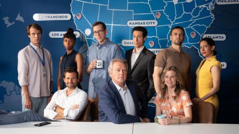 The cast of Twenty Twenty Six: Will Humphries (Hugh Skinner), Emily Fang (Nicole Sadie Sawyerr), Eric Van Dupuytrens (Alexis Michalik), Owen Mitchell (Stephen Kunken), Ian Fletcher (Hugh Bonneville), Nick Castellano (Paulo Costanzo), Phil Plank (Nick Blood), Sarah Campbell (Chelsey Crisp) and Gabriela De La Rosa (Jimena Larraguivel)