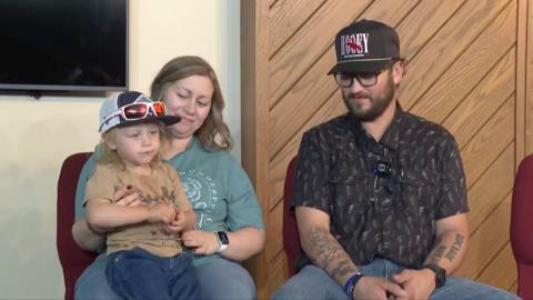 The boy with his parents