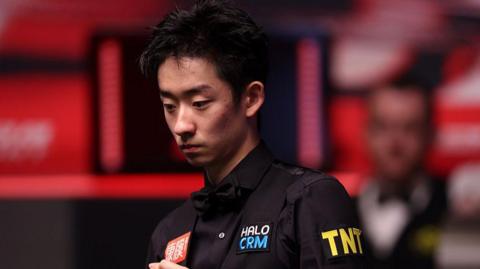 Wu Yize in black snooker outfit