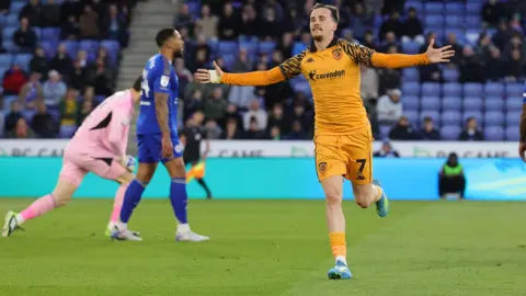 Liam Millar celebrates with his arms outstretched