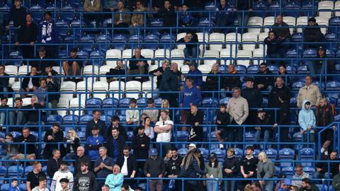Chelsea supporters watching team against Nottingham Forest with gaps and seats free during the latter minutes of a match they lost