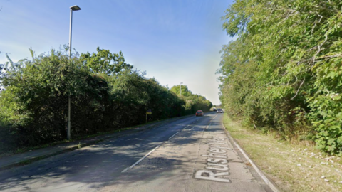 Google Street View of a road on a sunny day