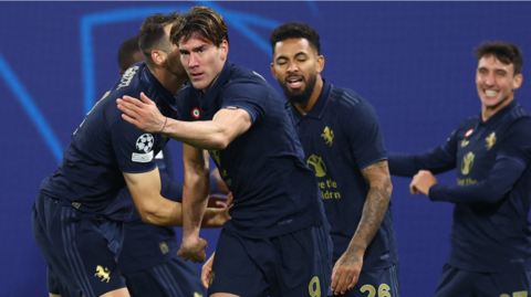 Juventus' players celebrate scoring against RB Leipzig in the Champions League