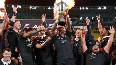 New Zealand lift the trophy after winning the second Test with France in 2025 to clinch a series victory