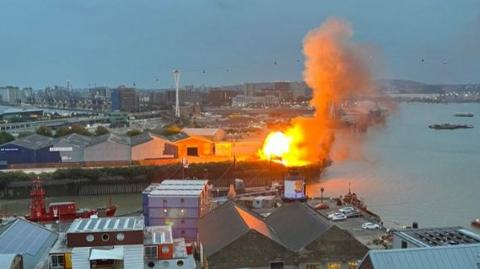 A fireball following the "controlled explosion" on a filmset in the Docklands.