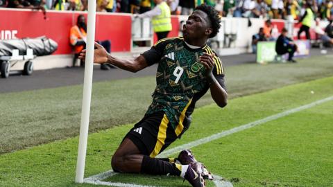 Kaheim Dixoncelebrates scoring for Jamaica against Nigeria in a friendly at Brentford in May 