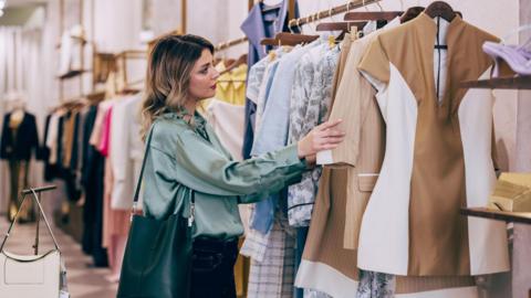 Woman shopping in a clothing boutique