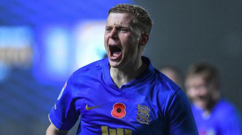 Birmingham City defender Alex Cochrane screams in celebration after scoring a goal