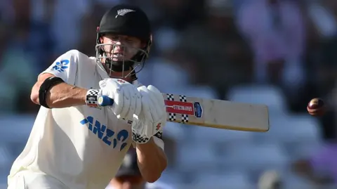 New Zealand batter Henry Nicholls plays a shot