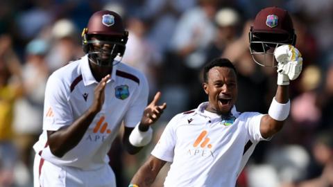 West Indies' Kavem Hodge celebrates reaching his century against England on day two of the second Test