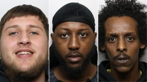 Three custody images in a row. Aslan is smiling, with a brown beard and flat short brown hair on his forehead. Usman has a neutral expression and black beard and moustache, and wears what appears to be a black durag. Ismail looks older than the others and stares at the camera. He has a black moustache and curly hair.