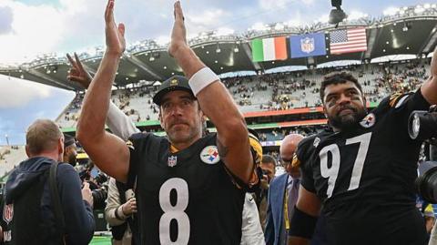 Aaron Rodgers and Cam Heyward salute the Pittsburgh Steelers fans after their win over the Minnesota Vikings in Dublin 