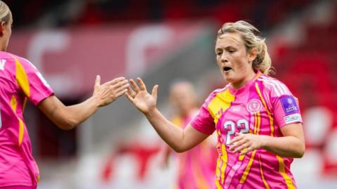 Erin Cuthbert celebrates