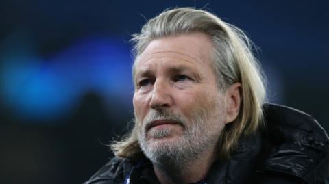 Robbie Savage looks on