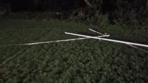 A set of rugby posts left in a pile on the floor after being uprooted from their ground in Cornwall.