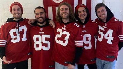 Gathering of Strangers wearing San Francisco 49ers shirts