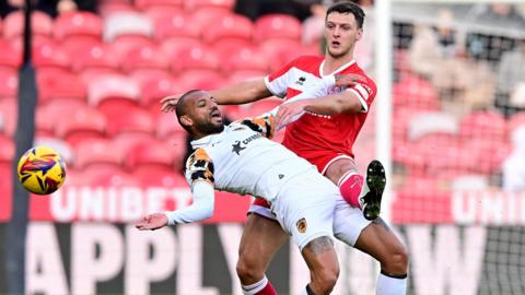 Middlesbrough defender Dael Fry challenges Hull's Joao Pedro