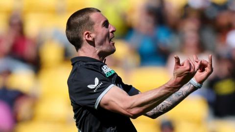 New Zealand fast bowler Blair Tickner celebrates taking a wicket