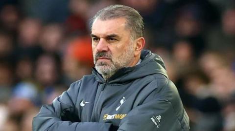 Ange Postecoglou wearing a Tottenham coat