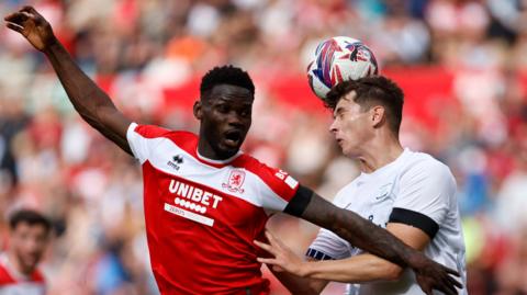 Middlesbrough's Emmanuel Latte Lath and Preston North End's Jordan Store battle for the ball