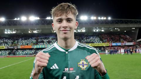 Isaac Price celebrates after Northern Ireland beat Denmark