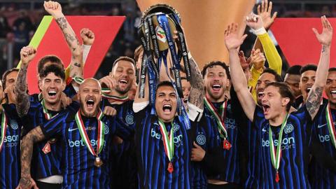 Intern Milan lift the Coppa Italia trophy after the team's victory in the Coppa Italia Final match against Lazio at Stadio Olimpico on May 13, 2026
