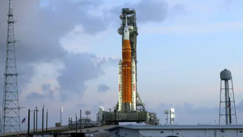 NASA's Artemis II lunar flyby mission, with the next-generation moon rocket, the Space Launch System (SLS) rocket and the Orion crew capsule, sits on Pad 39B ahead of the launch of the Artemis II mission at the Kennedy Space Center in Cape Canaveral, Florida, U.S., March 31, 2026.