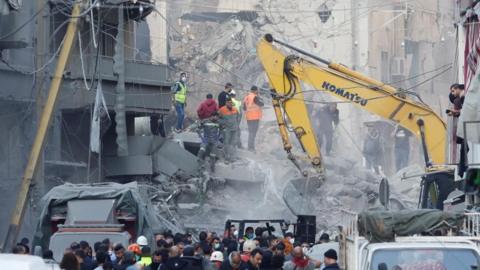 Rescuers search through the rubble of a building following Israeli air strikes on Beirut, Lebanon. Photo: 23 November 2024