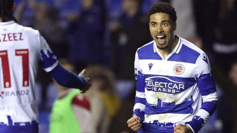 Reading's Harvey Knibbs celebrates with his teammate Femi Azeez.