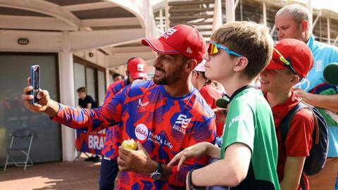 Southern Brave's Saif Zaib takes a photo with a fan